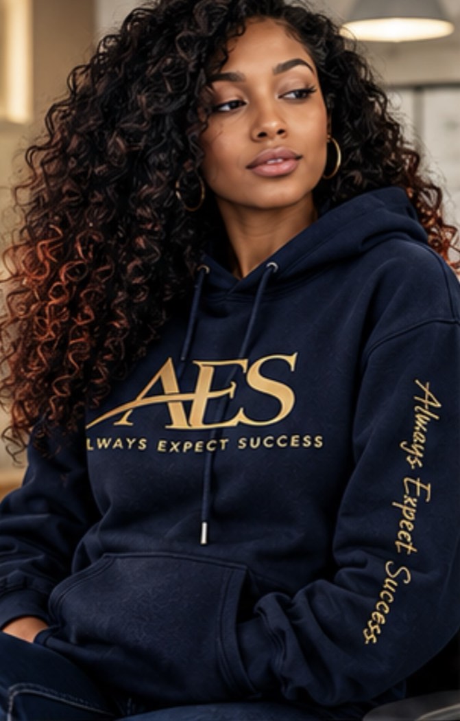 Woman in the navy AES hoodie with the script sleeve